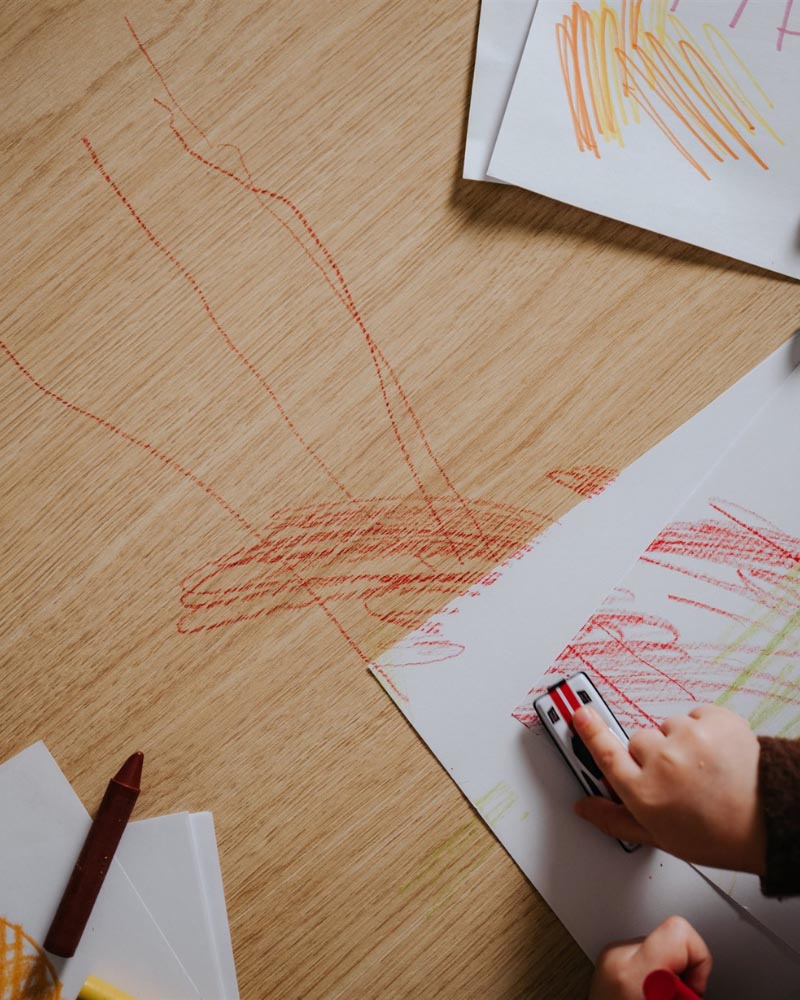 Child drawing on Master Oak tabletop