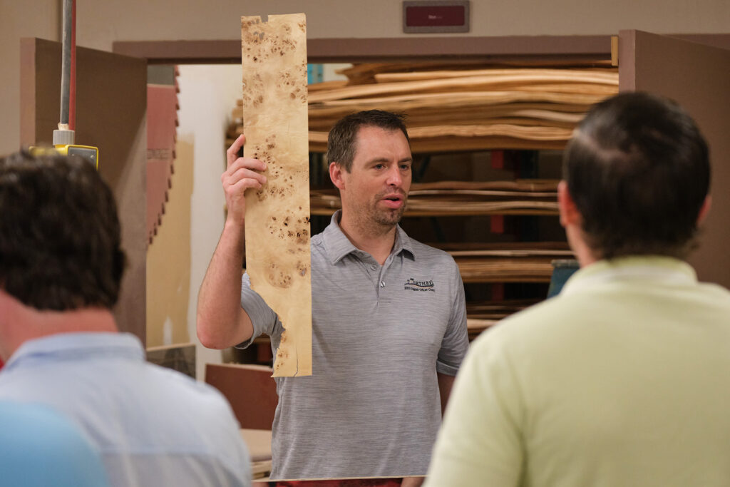 Doug Hague holding wood