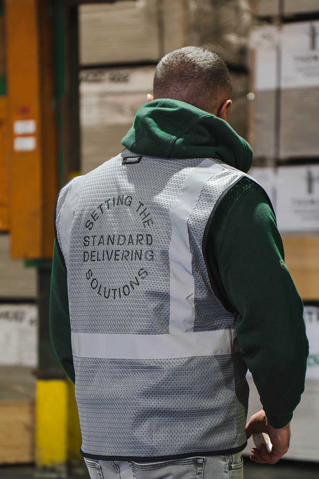 worker wearing setting the standard vest