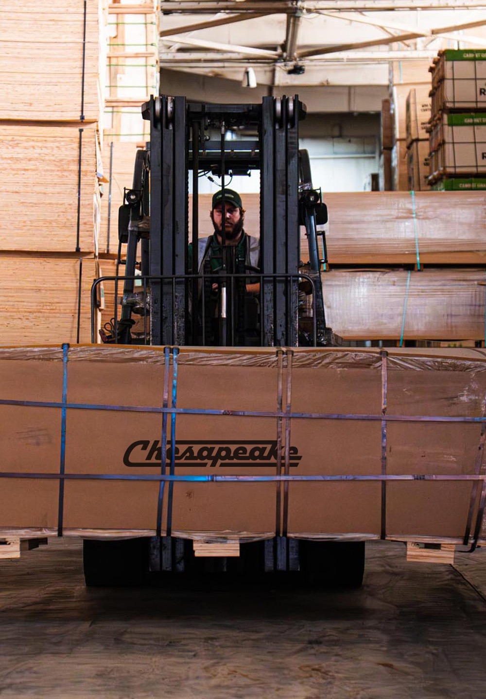 forklift moving box in chesapeake warehouse vertical