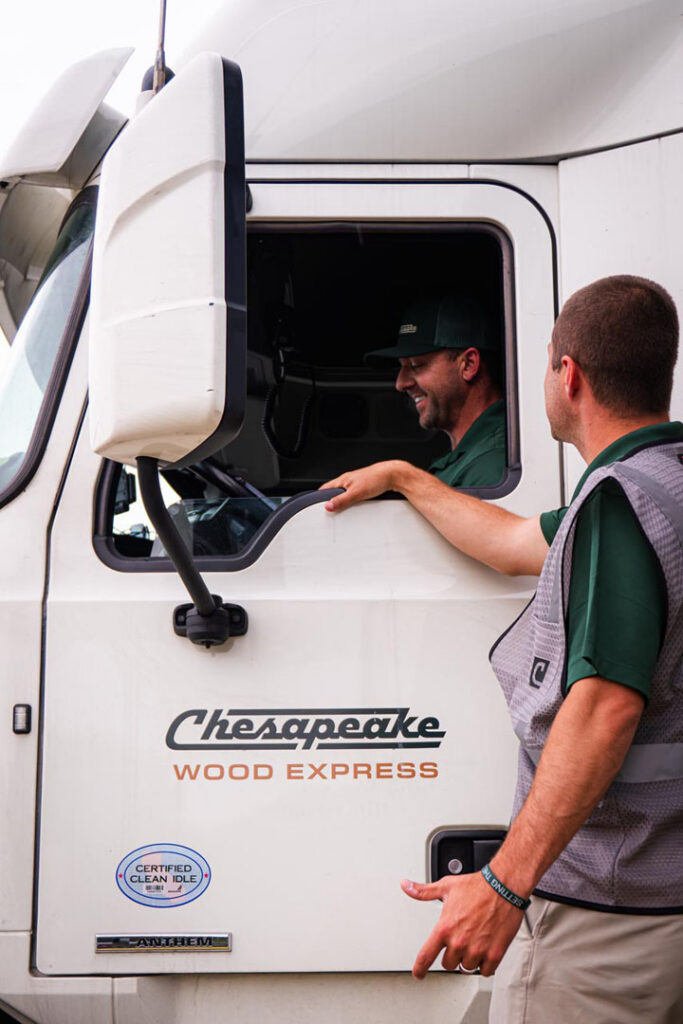 worker chatting to truck driver