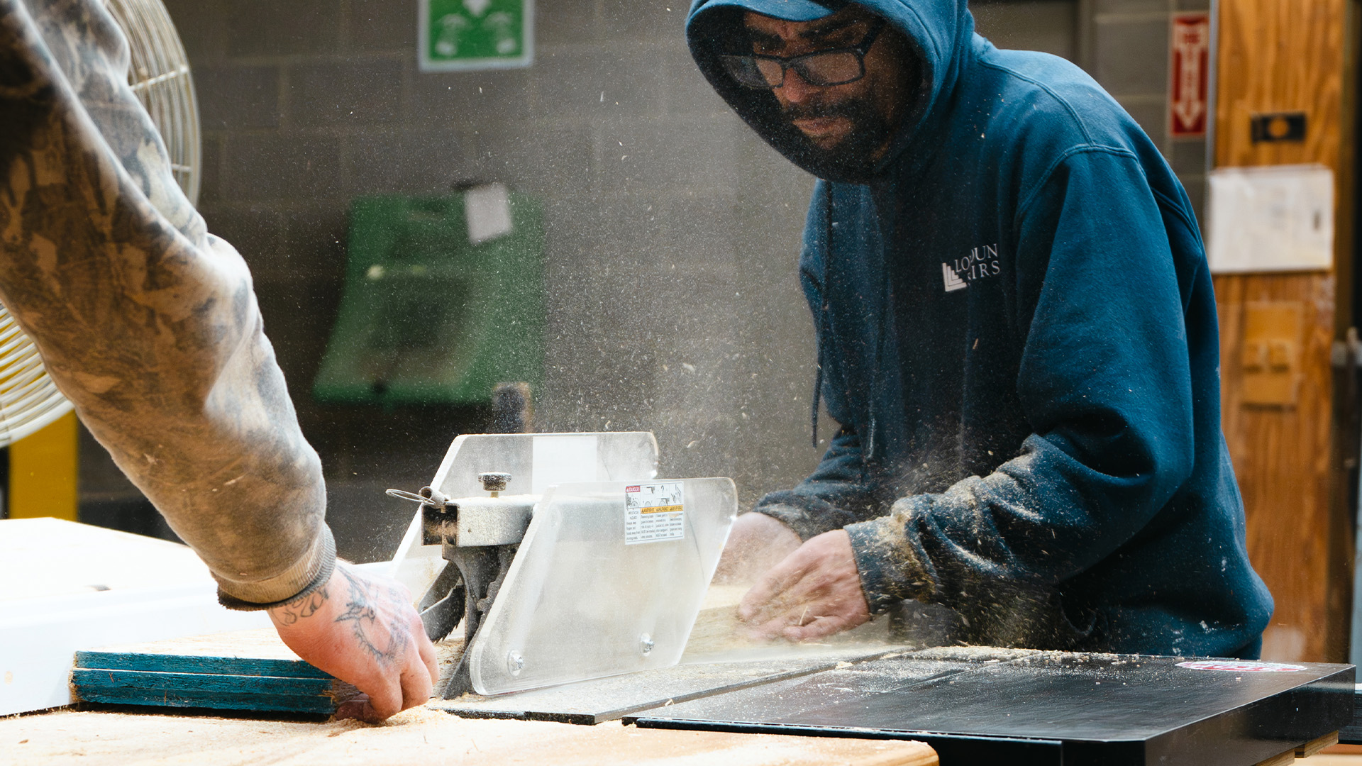 millworker processing wood panel 1920×1080